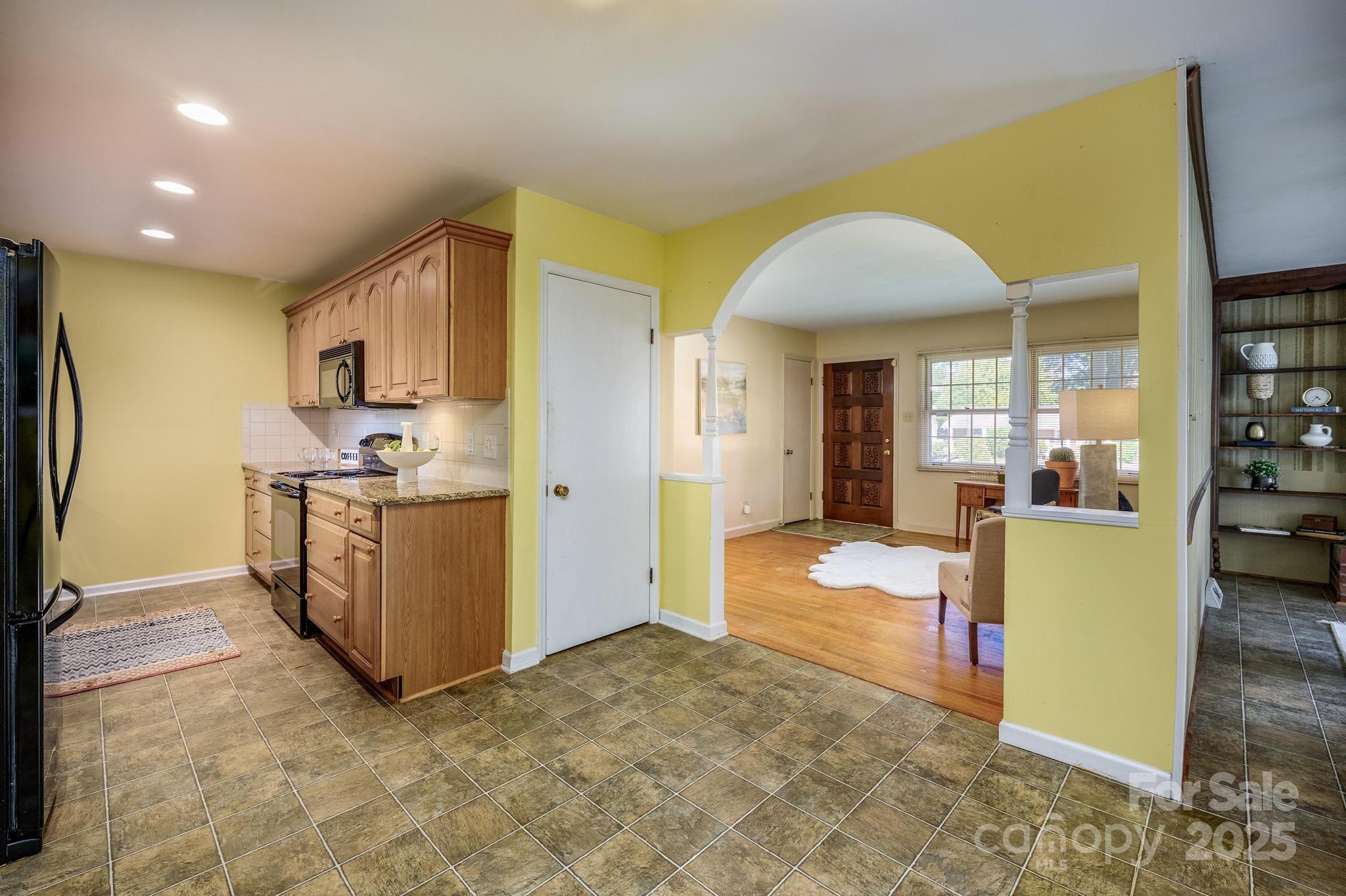 4314 Ivanhoe Place, Unit 26 Charlotte, NC 28205 - Photo 6 of 25 a view of kitchen with furniture and refrigerator