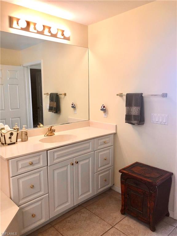 451 Bayfront Place, Unit 5311 Naples, FL 34102 - Photo 29 of 38 a spacious bathroom with a double vanity sink and mirror