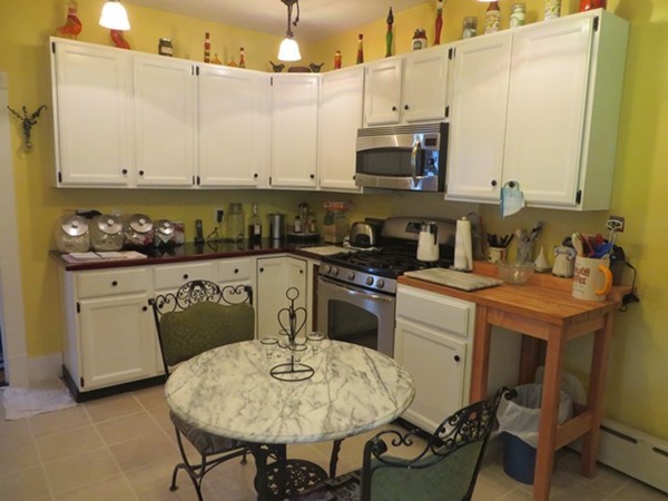 258 Main Road Colrain, MA 01340 - Photo 11 of 29 a kitchen with a sink cabinets and wooden floor