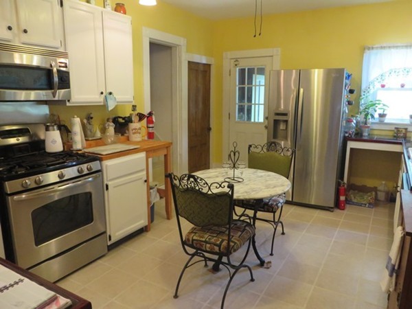 258 Main Road Colrain, MA 01340 - Photo 12 of 29 a kitchen with stainless steel appliances a stove a sink and a refrigerator