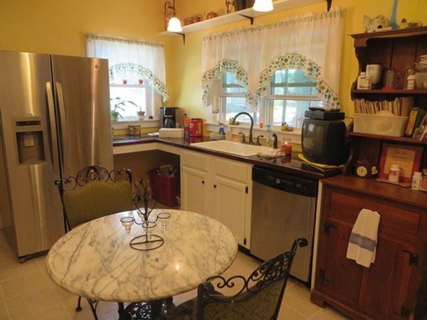 258 Main Road Colrain, MA 01340 - Photo 13 of 29 a kitchen with stainless steel appliances a sink and a refrigerator