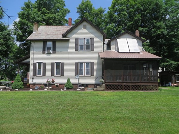 258 Main Road Colrain, MA 01340 - Photo 28 of 29 a front view of a house with a garden and yard