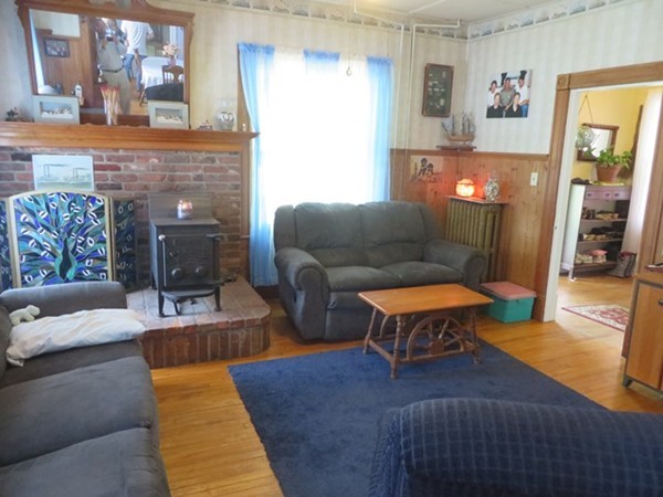 258 Main Road Colrain, MA 01340 - Photo 9 of 29 a living room with furniture and a fireplace