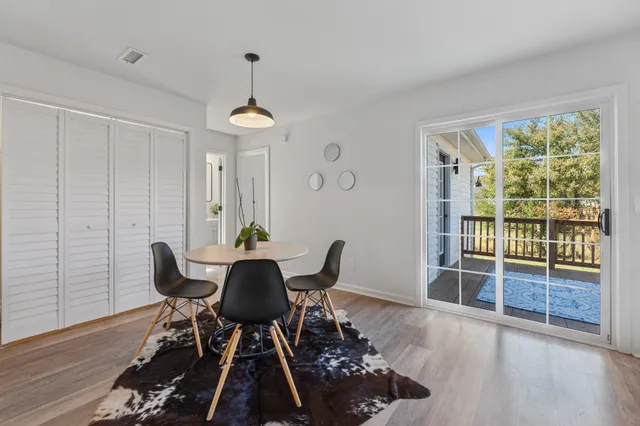 a balcony with wooden floor and fence