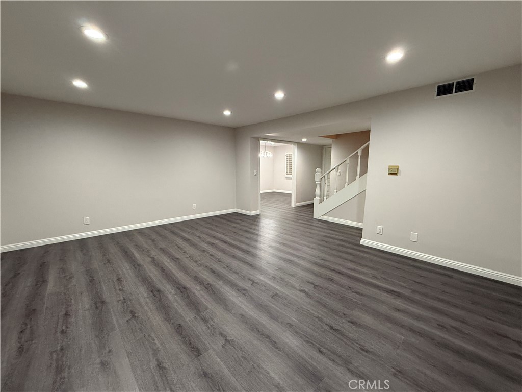 19312 Gunlock Avenue Carson, CA 90746 - Photo 14 of 44 a view of an empty room with wooden floor
