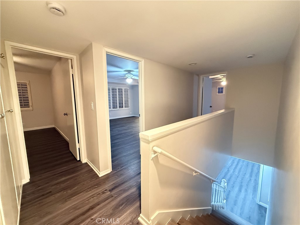 19312 Gunlock Avenue Carson, CA 90746 - Photo 17 of 44 a view of a hallway with wooden floor