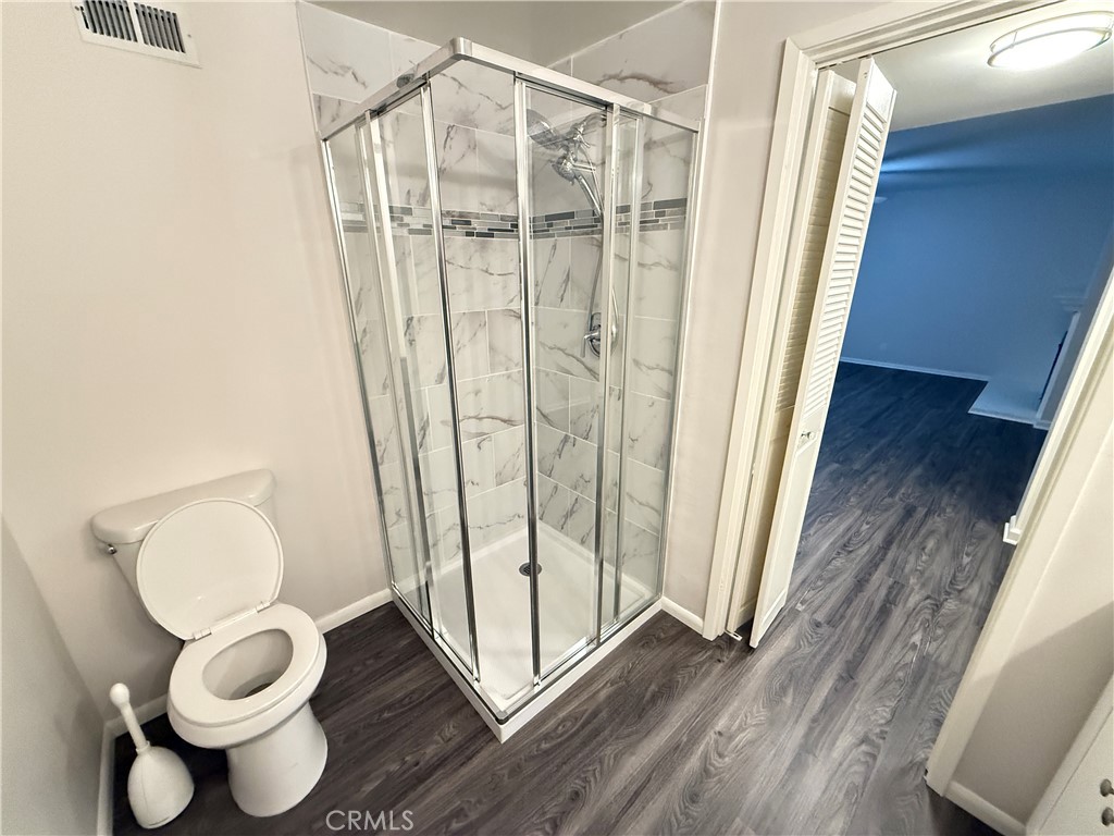 19312 Gunlock Avenue Carson, CA 90746 - Photo 23 of 44 a bathroom with a toilet and a shower