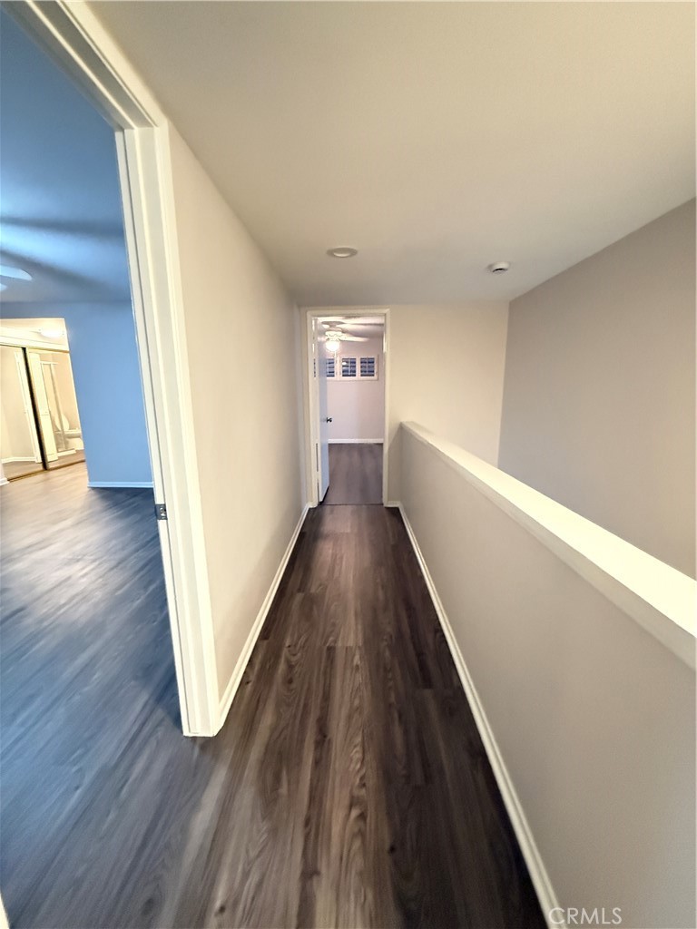 19312 Gunlock Avenue Carson, CA 90746 - Photo 24 of 44 a view of a hallway with wooden floor