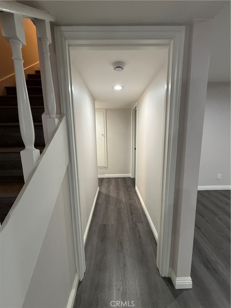 19312 Gunlock Avenue Carson, CA 90746 - Photo 33 of 44 a view of a hallway with wooden floor and staircase