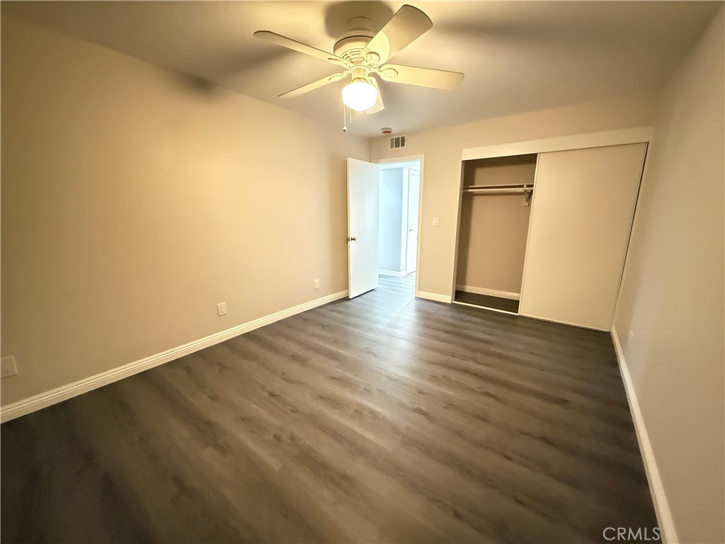 19312 Gunlock Avenue Carson, CA 90746 - Photo 36 of 44 an empty room with wooden floor and fan