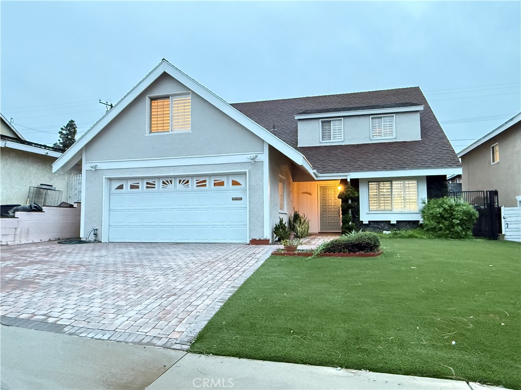 19312 Gunlock Avenue Carson, CA 90746 - Photo 44 of 44 a front view of a house with a yard and garage