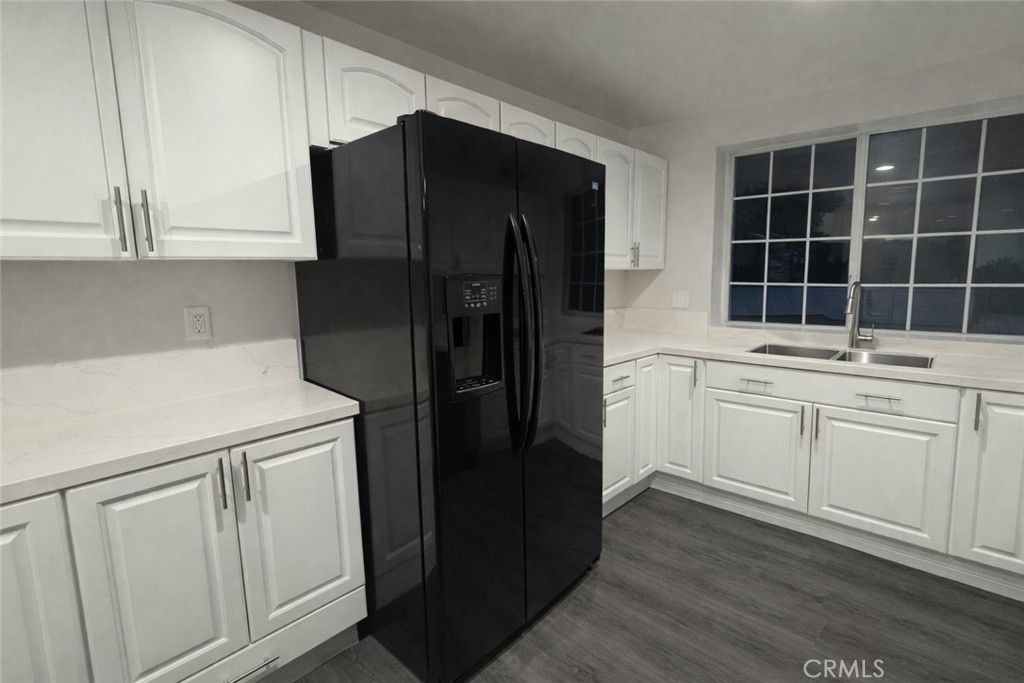 19312 Gunlock Avenue Carson, CA 90746 - Photo 5 of 44 a kitchen with a refrigerator and cabinets