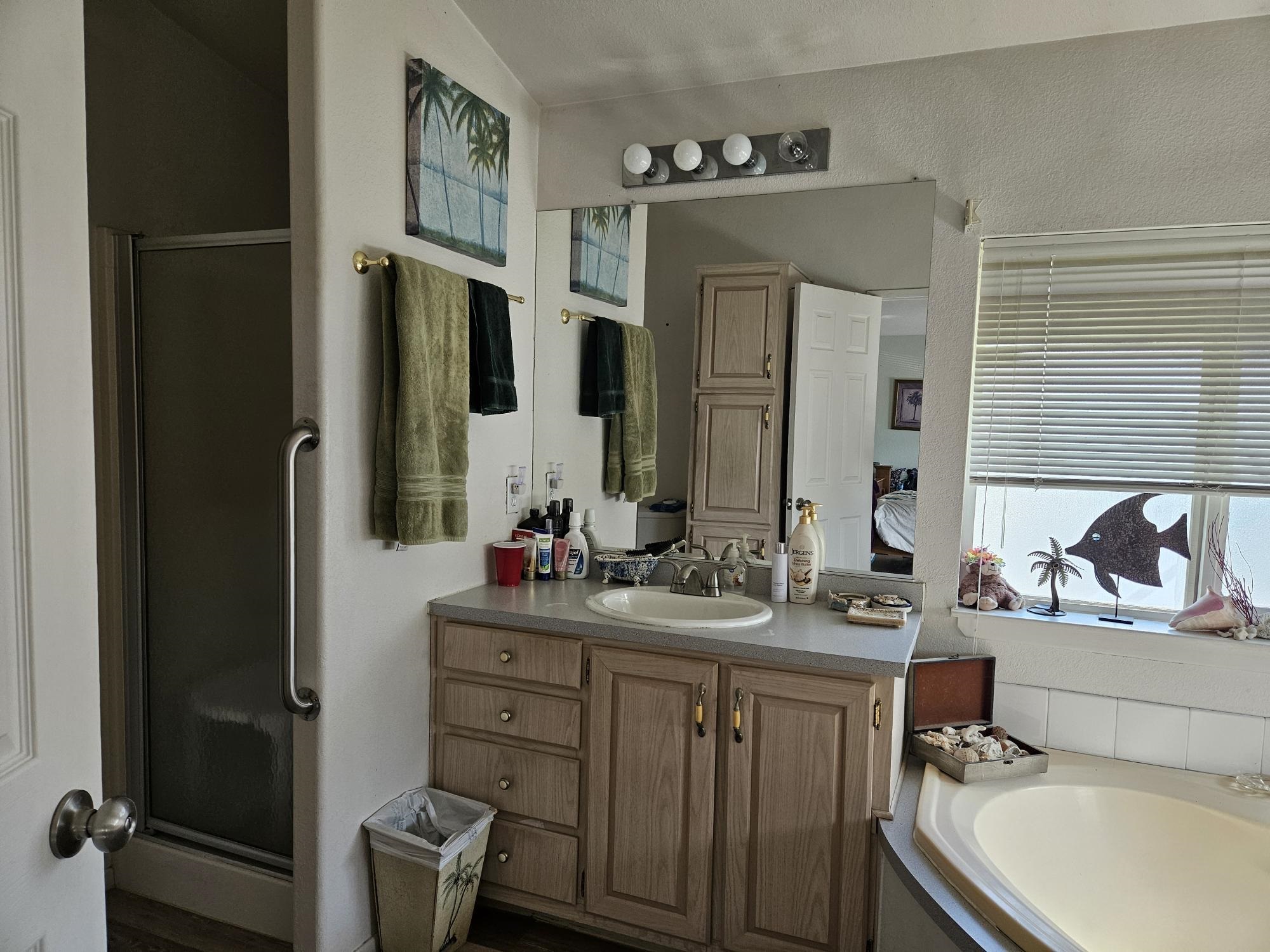 435 32 Road, Unit 424 Clifton, CO 81520 - Photo 18 of 21 a bathroom with a double vanity sink and mirror