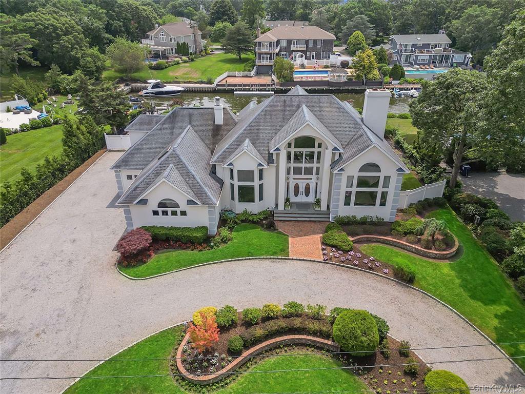 an aerial view of a house with garden space and street view