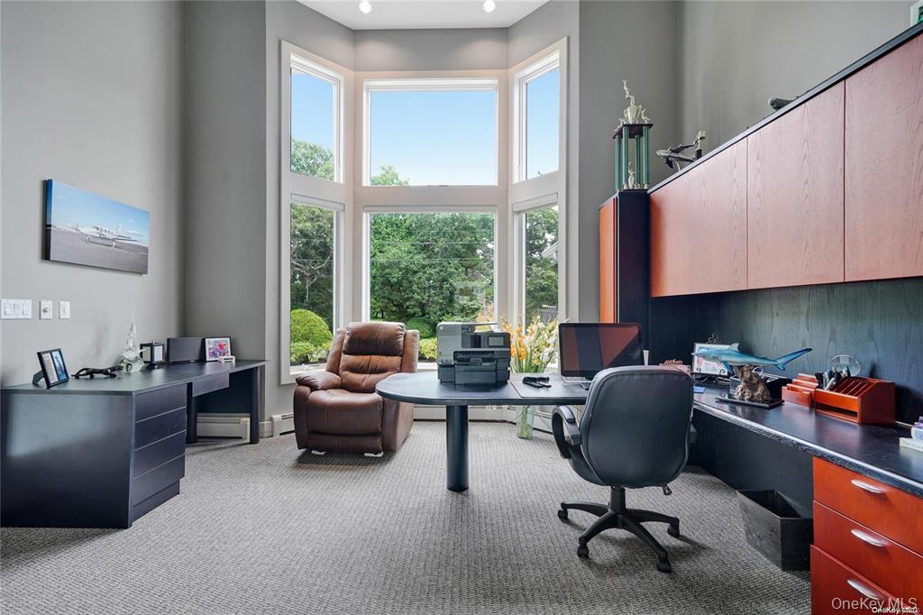 4 Mill Pond Road Hampton Bays, NY 11946 - Photo 17 of 24 a view of a workspace with furniture and a window
