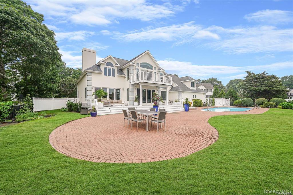 4 Mill Pond Road Hampton Bays, NY 11946 - Photo 21 of 24 a view of a house with a big yard and a fountain