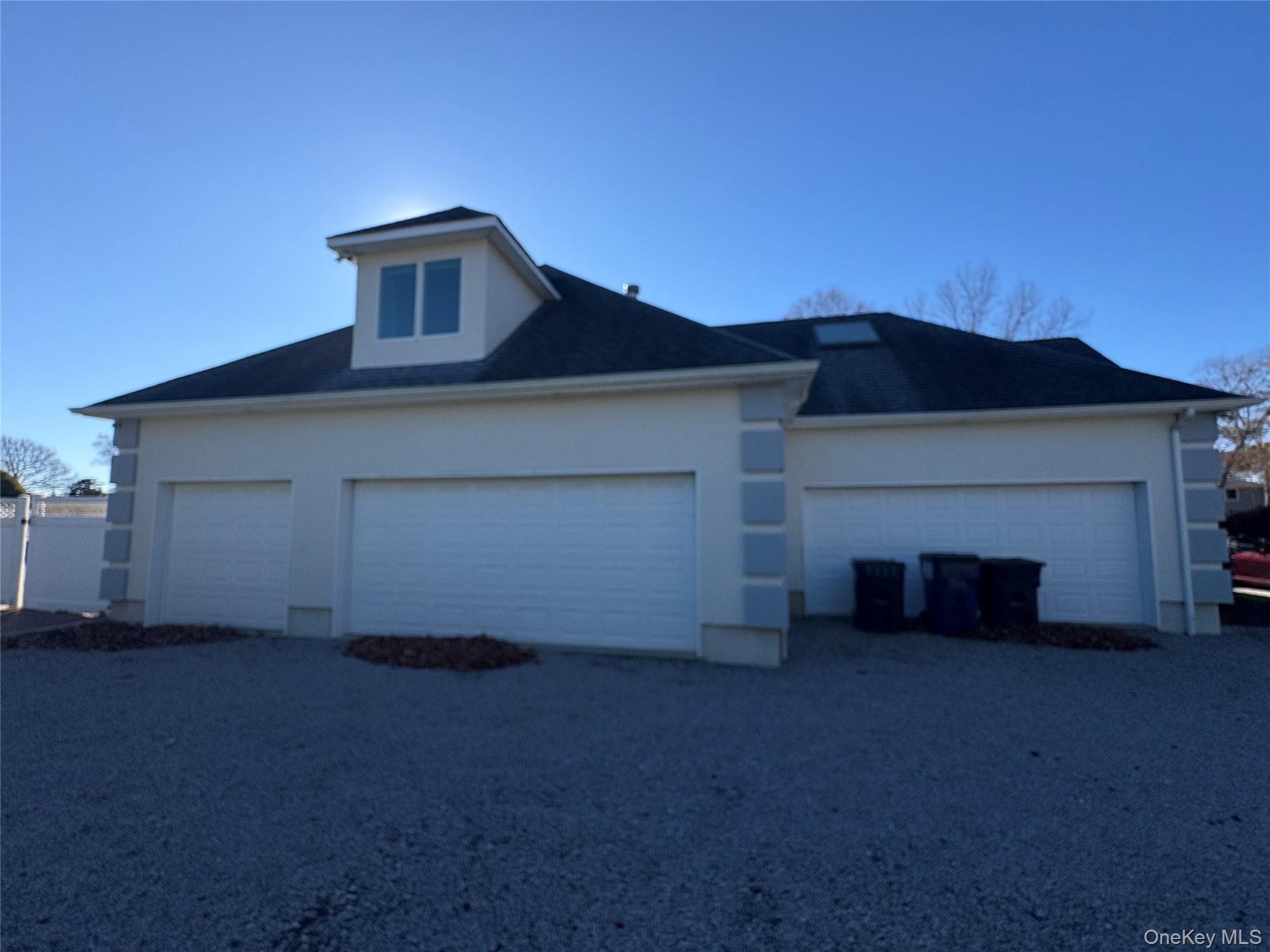 4 Mill Pond Road Hampton Bays, NY 11946 - Photo 7 of 24 a front view of a house with a yard