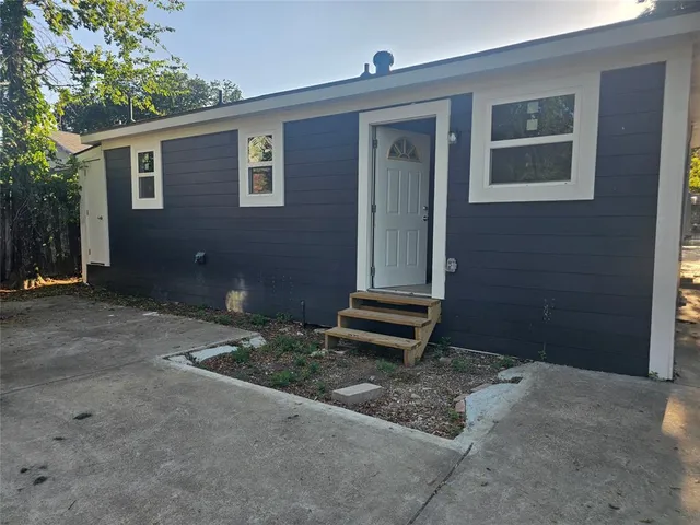 a view of park with large trees