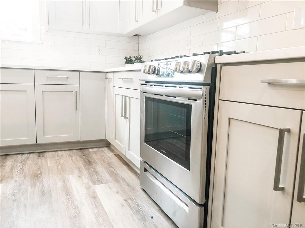 7825 Chestnut Ridge Drive Charlotte, NC 28215 - Photo 23 of 44 a utility room with dryer and washer