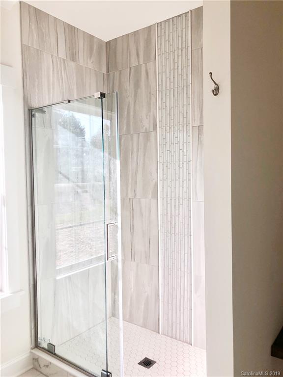 7825 Chestnut Ridge Drive Charlotte, NC 28215 - Photo 30 of 44 a bathroom with a shower
