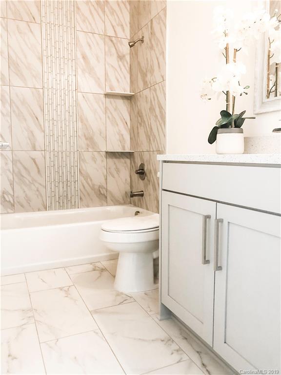 7825 Chestnut Ridge Drive Charlotte, NC 28215 - Photo 37 of 44 a bathroom with a sink a toilet and shower