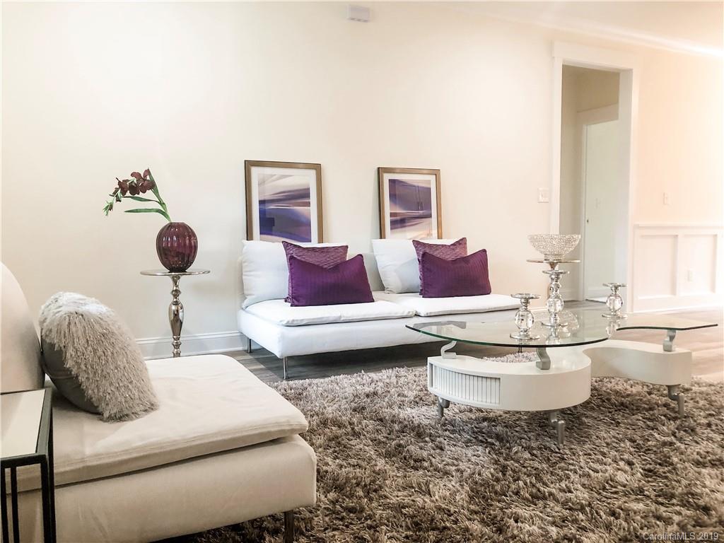 7825 Chestnut Ridge Drive Charlotte, NC 28215 - Photo 5 of 44 a living room with furniture and white walls
