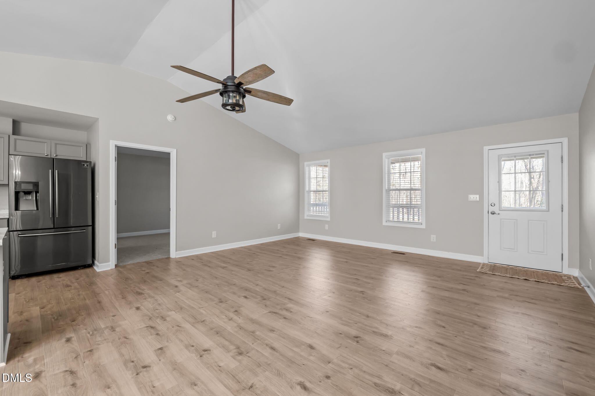 144 Kiser Hicks Road Roxboro, NC 27574 - Photo 12 of 38 a view of empty room with wooden floor and fan
