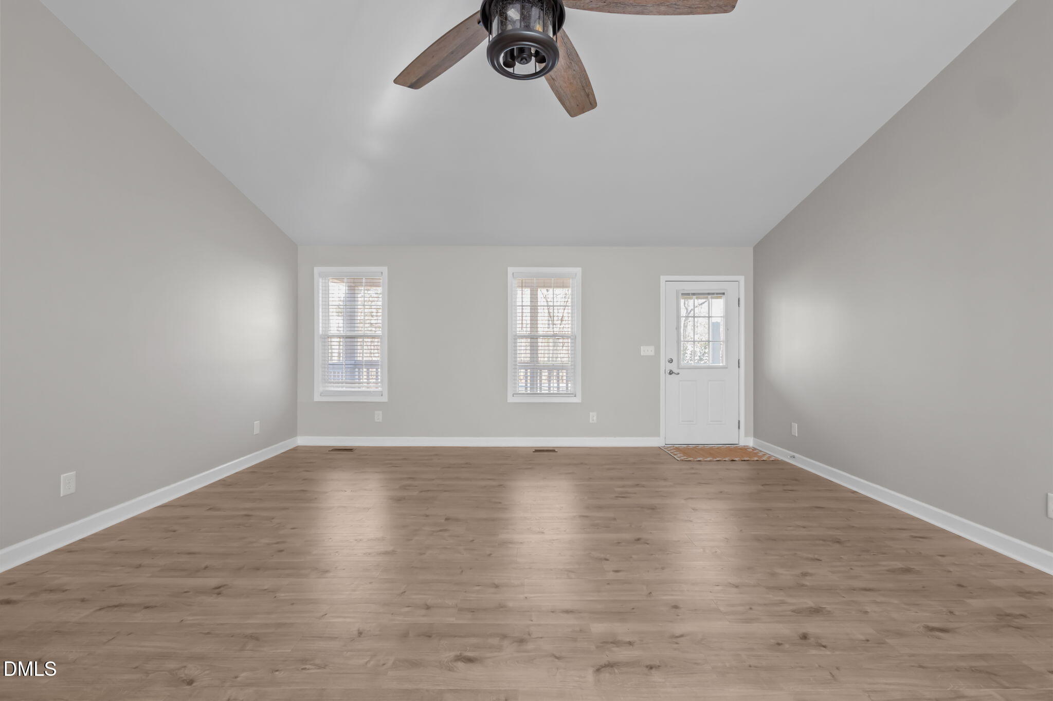 144 Kiser Hicks Road Roxboro, NC 27574 - Photo 13 of 38 a view of an empty room with a window and wooden floor