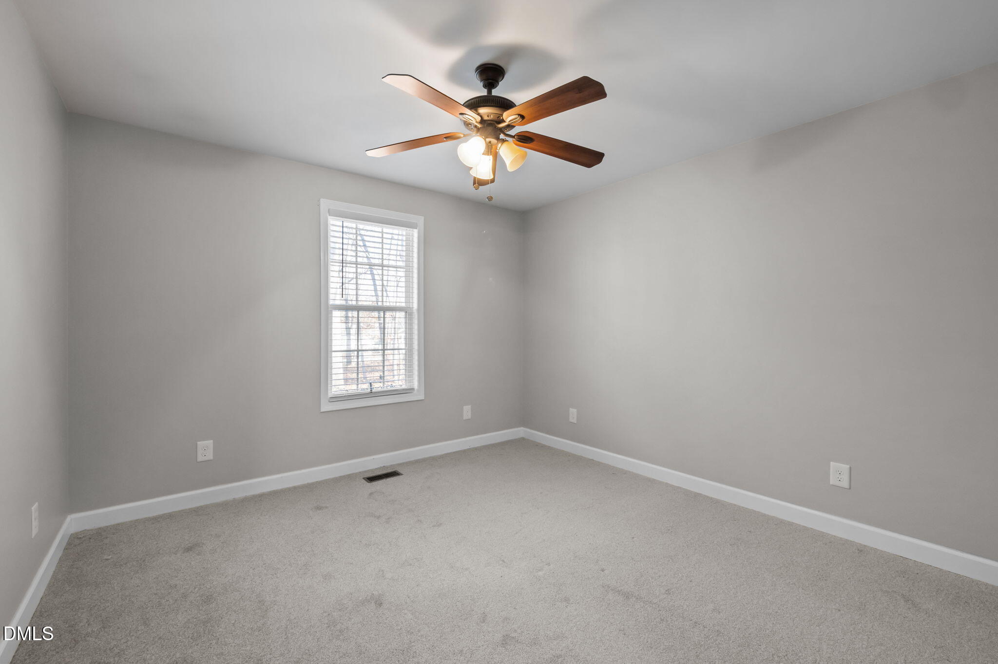 144 Kiser Hicks Road Roxboro, NC 27574 - Photo 20 of 38 an empty room with window and ceiling fan