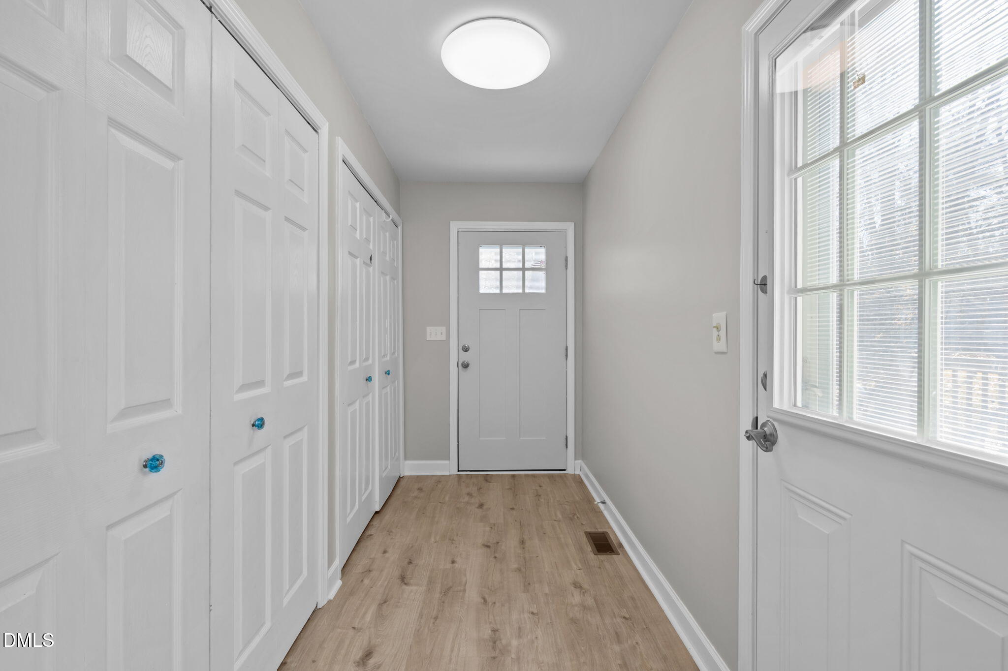 144 Kiser Hicks Road Roxboro, NC 27574 - Photo 22 of 38 a view of a hallway with wooden floor and closet