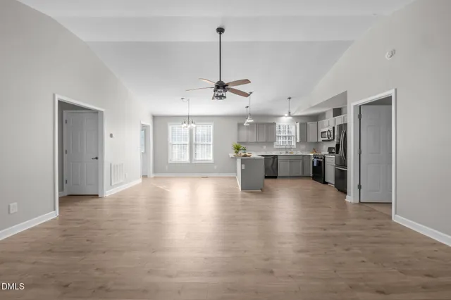 a view of a kitchen with a sink and cabinet area