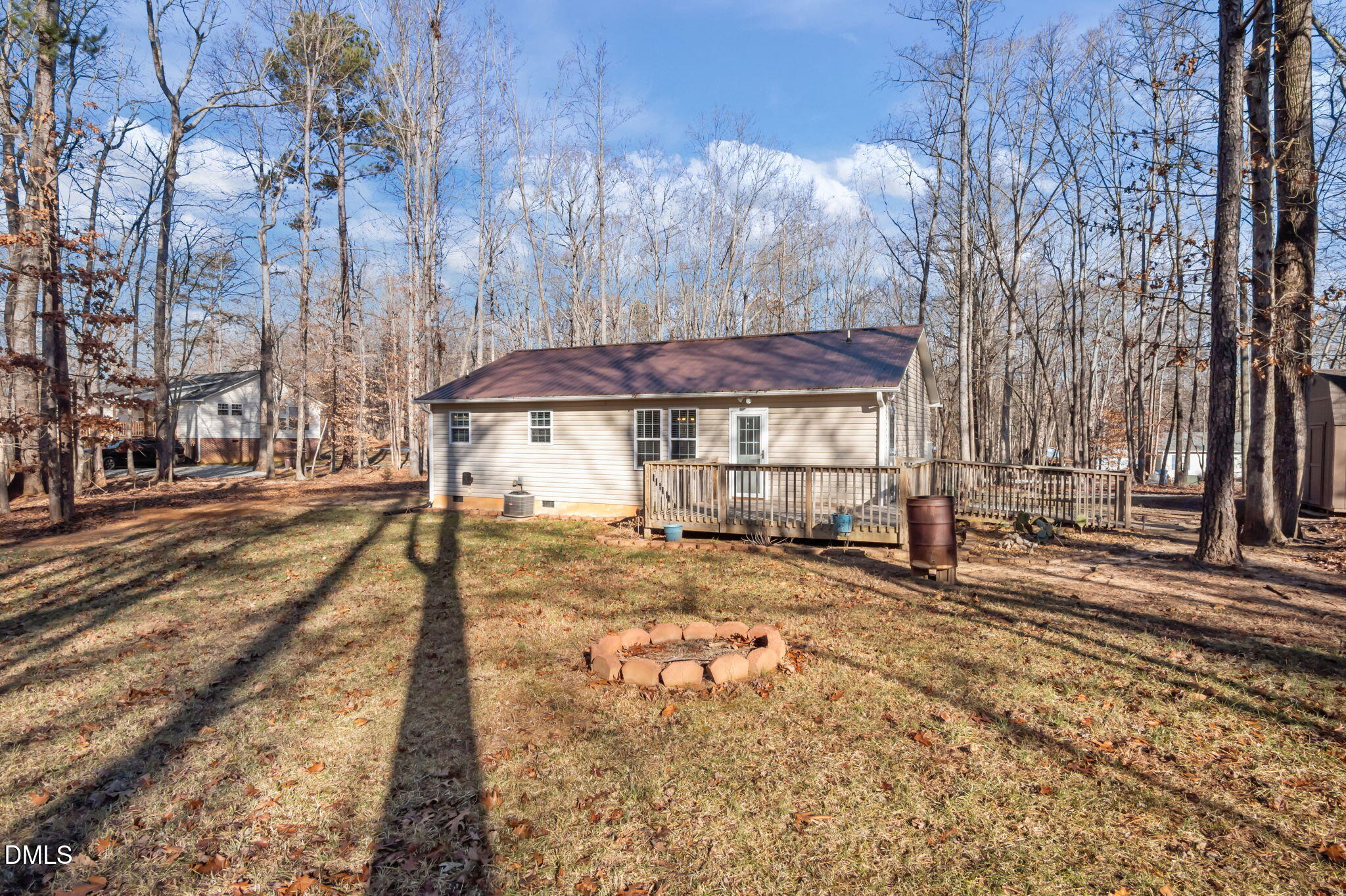 144 Kiser Hicks Road Roxboro, NC 27574 - Photo 32 of 38 a view of a house with a yard and trees