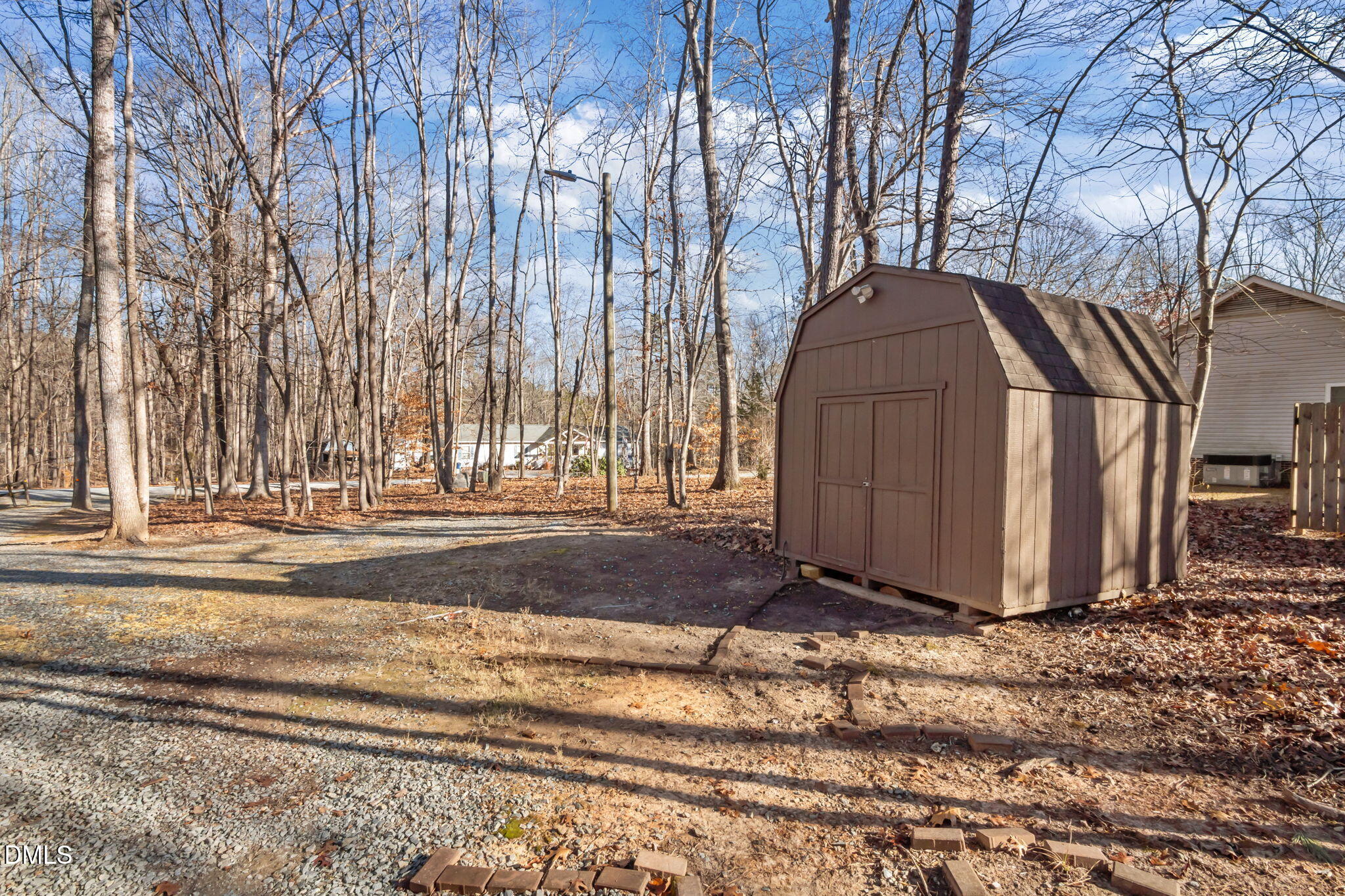 144 Kiser Hicks Road Roxboro, NC 27574 - Photo 34 of 38 a view of a house with a yard covered with snow