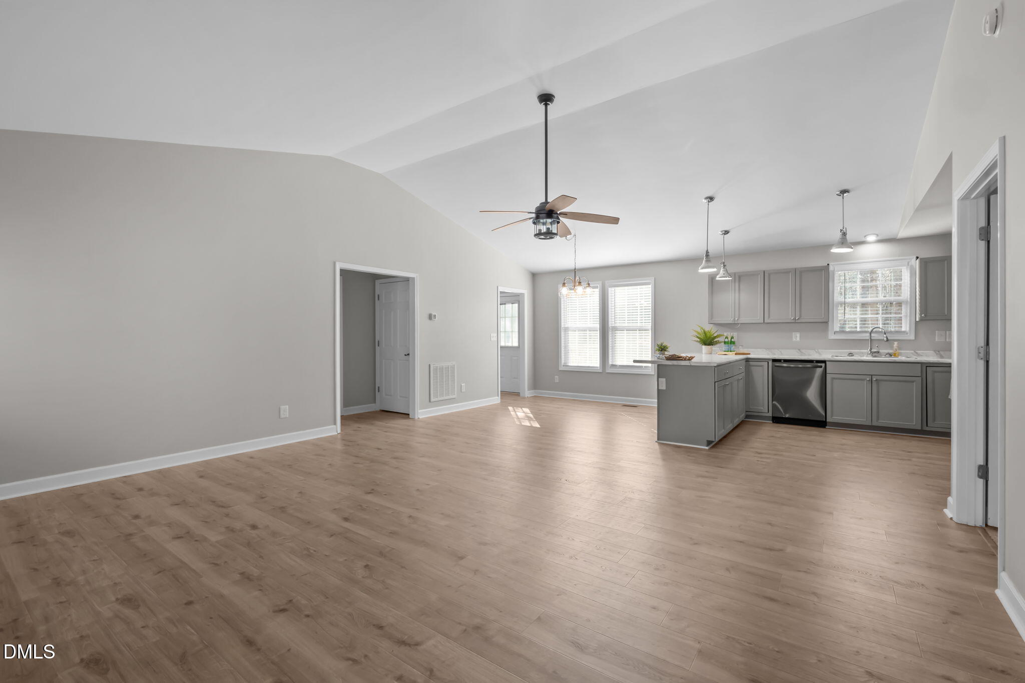 144 Kiser Hicks Road Roxboro, NC 27574 - Photo 4 of 38 a view of a big room with wooden floor and windows