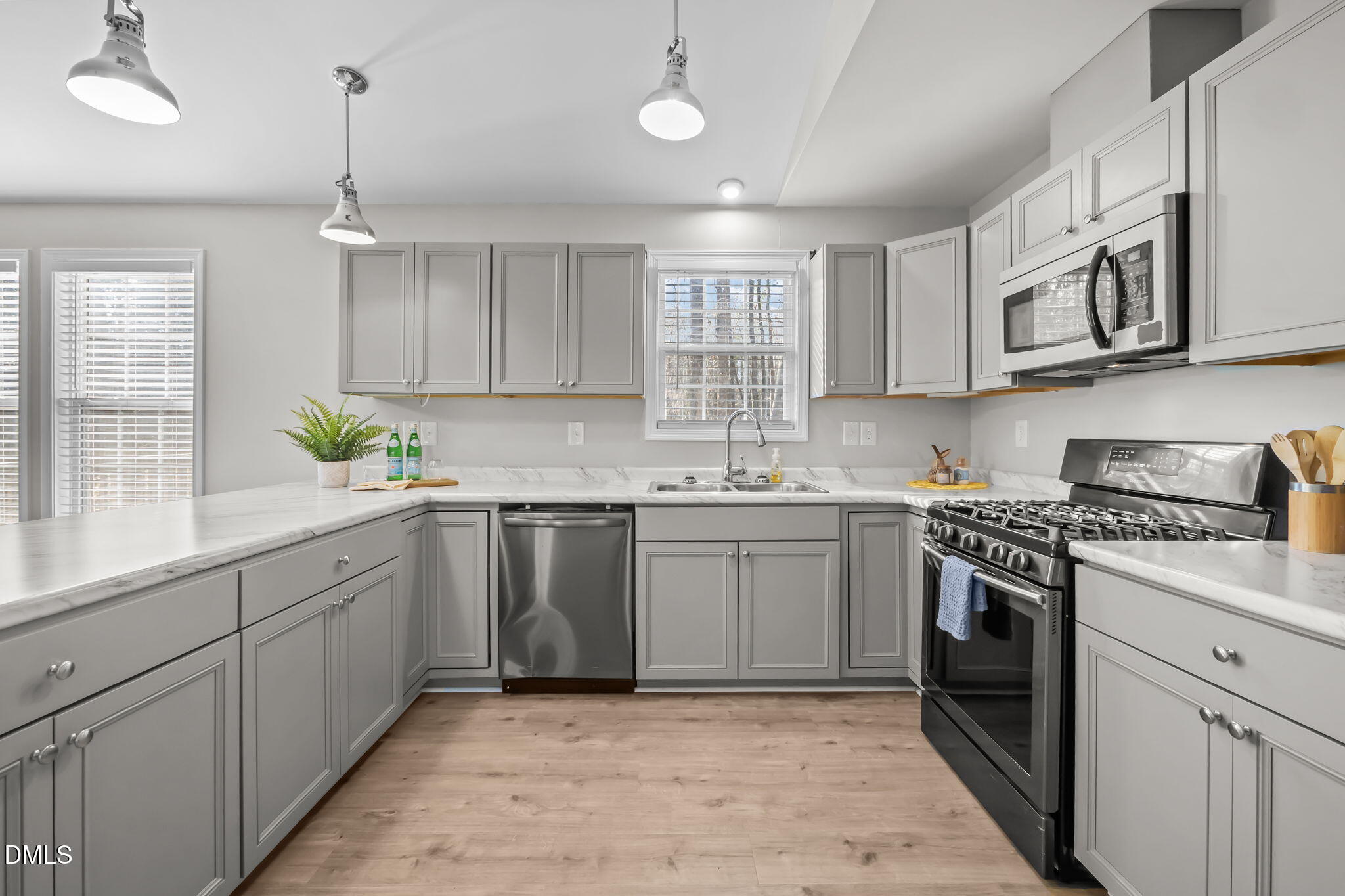 144 Kiser Hicks Road Roxboro, NC 27574 - Photo 7 of 38 a kitchen with a sink stove and cabinets