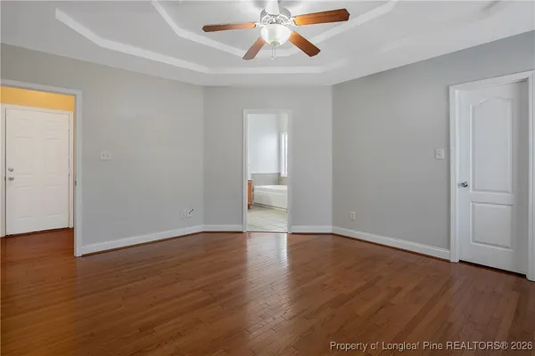 a spacious bathroom with a granite countertop sink mirror and toilet