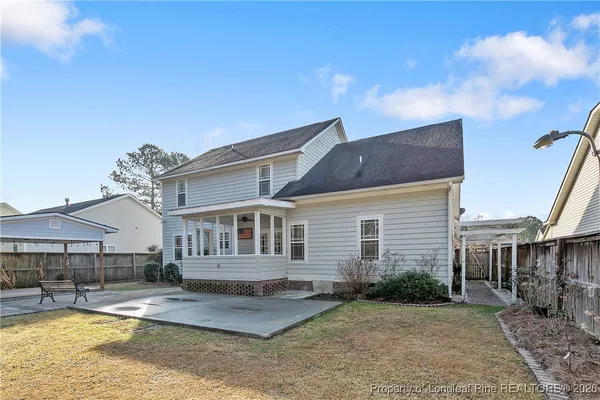 a view of a backyard with a patio