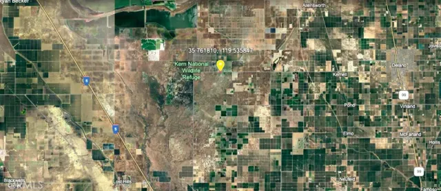 a view of residential houses with glass door and balcony