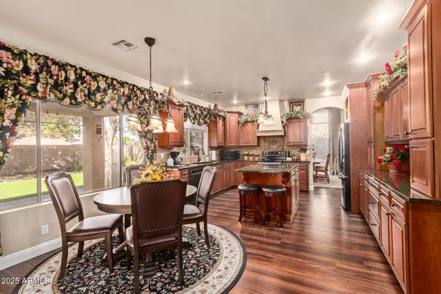 a dining room with furniture and wooden floor