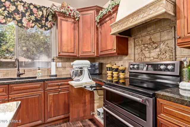 a kitchen with a stove and a sink