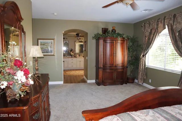 a bedroom with a bed and a dresser