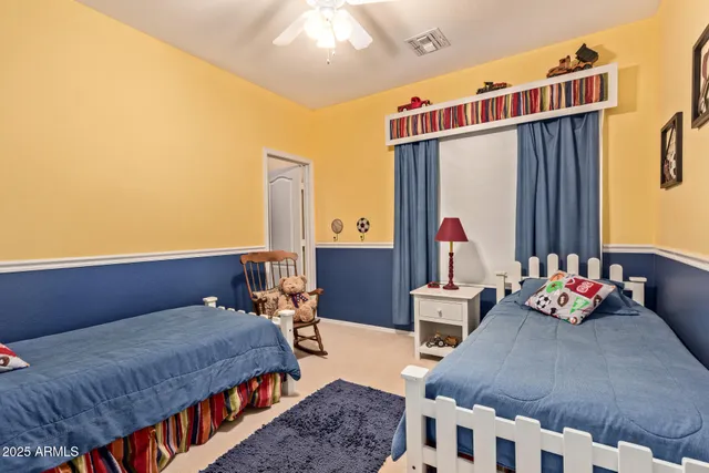 a bedroom with furniture and a window