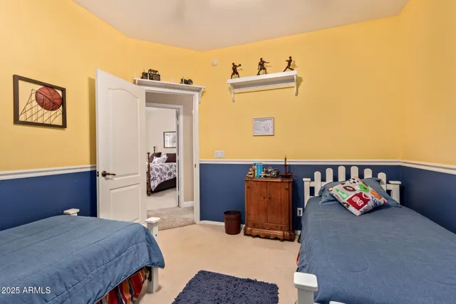 a bedroom with a bed and dresser