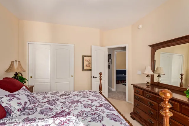 a bedroom with a bed and a dresser