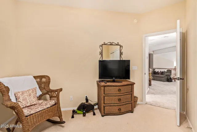 a room with furniture and flat screen tv