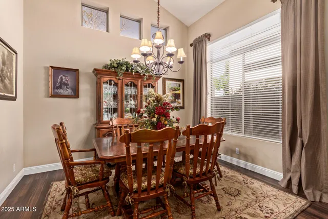a view of a dining room with furniture and window