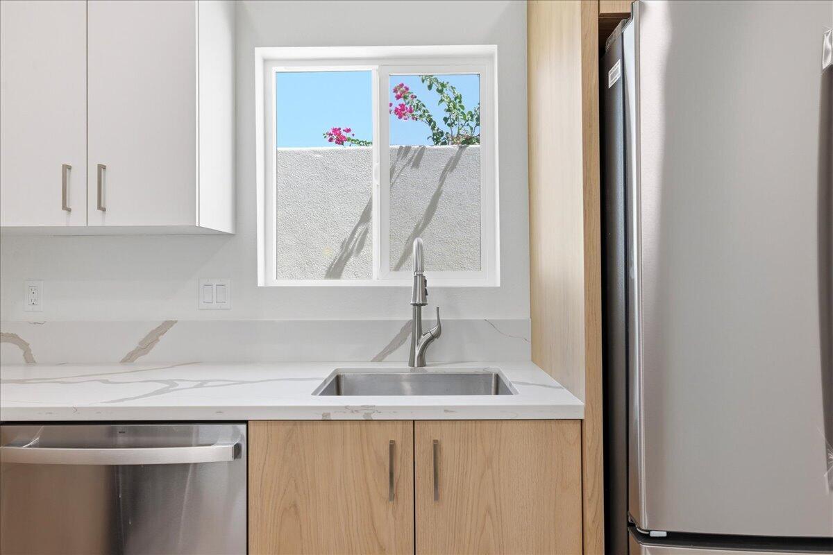 68160 Modalo Road Cathedral City, CA 92234 - Photo 44 of 57 a kitchen with a sink and cabinets