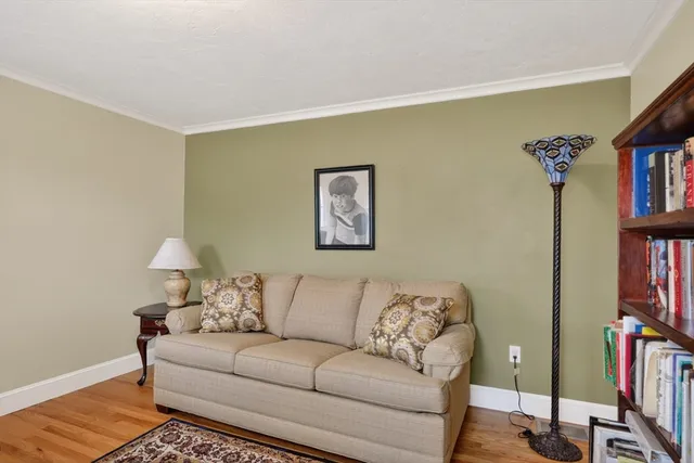 a living room with furniture and a lamp