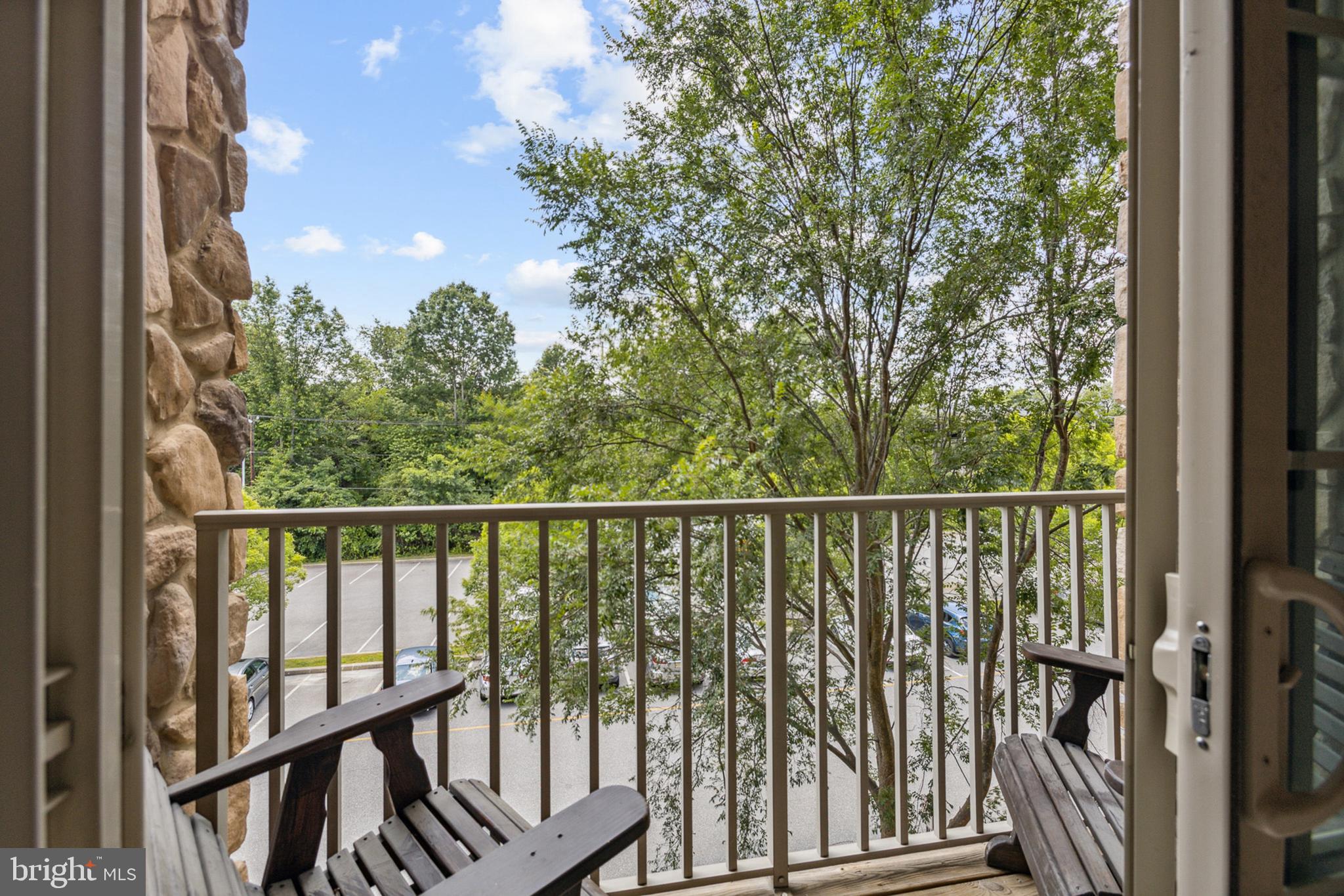 3000 Fountainview Circle, Unit 3311 Newark, DE 19713 - Photo 12 of 32 a view of a balcony with wooden floor and fence