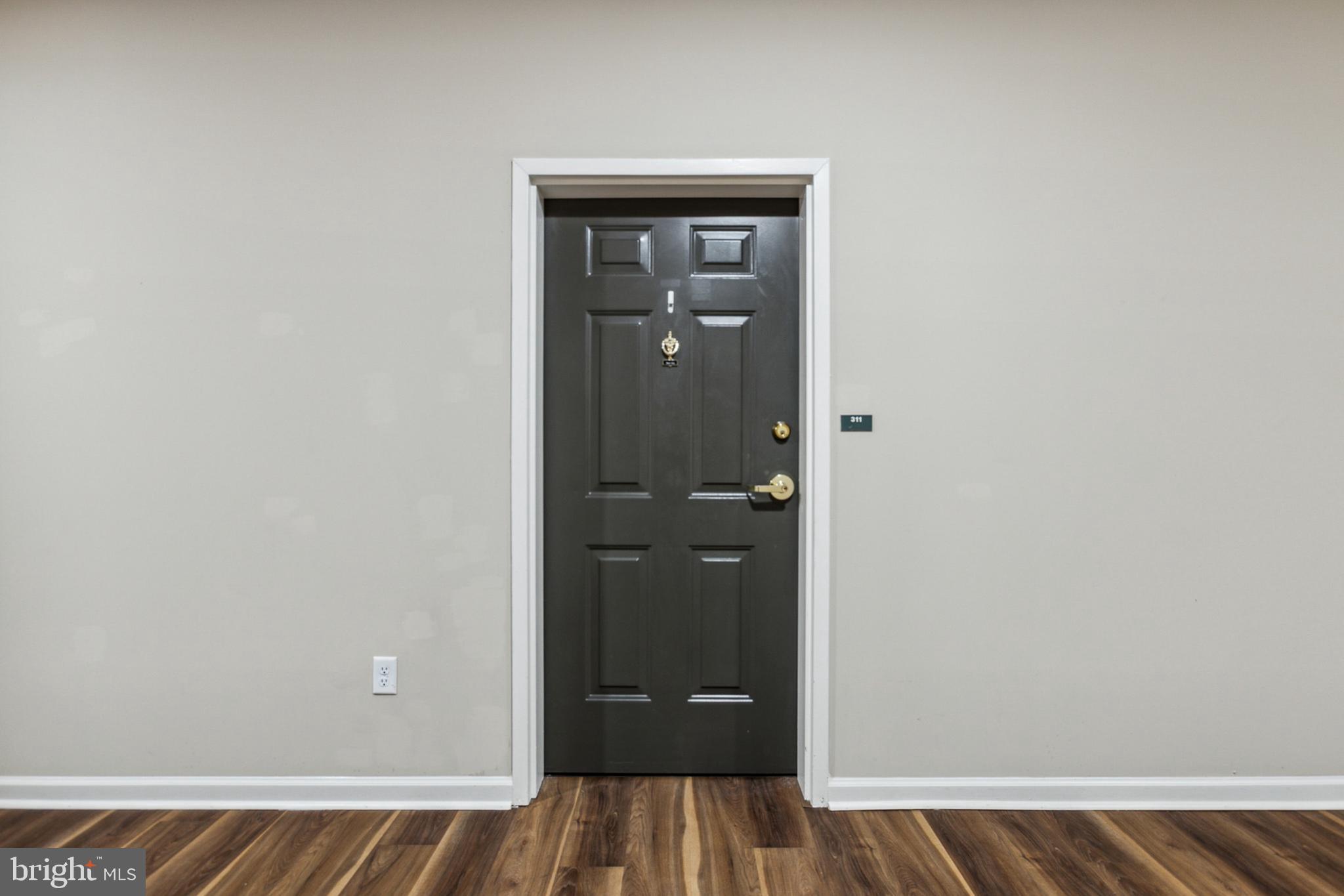 3000 Fountainview Circle, Unit 3311 Newark, DE 19713 - Photo 9 of 32 a view of a hallway with wooden floor and closet
